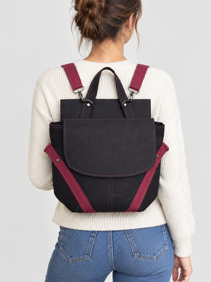 Sac à dos Frida porté de dos — toile noire et sangles bordeaux